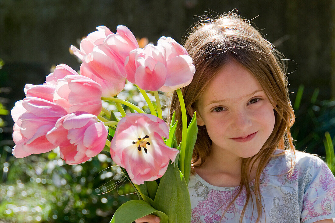 Girl holding tulips