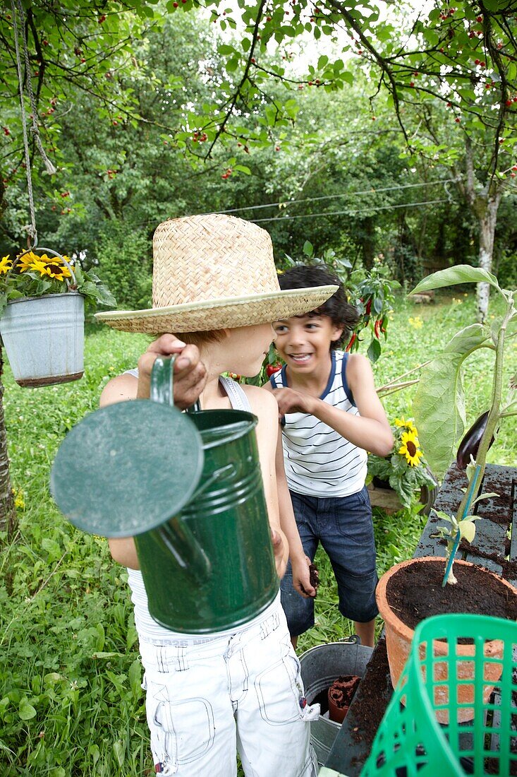 Boy with watering can