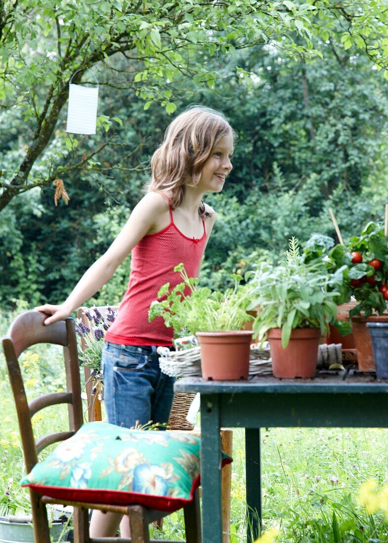 Girl at table in orchard