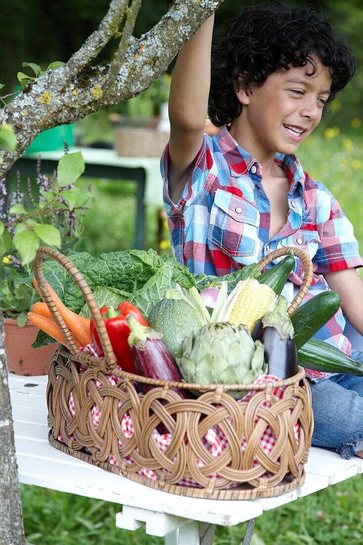 Boy with vegetable basket