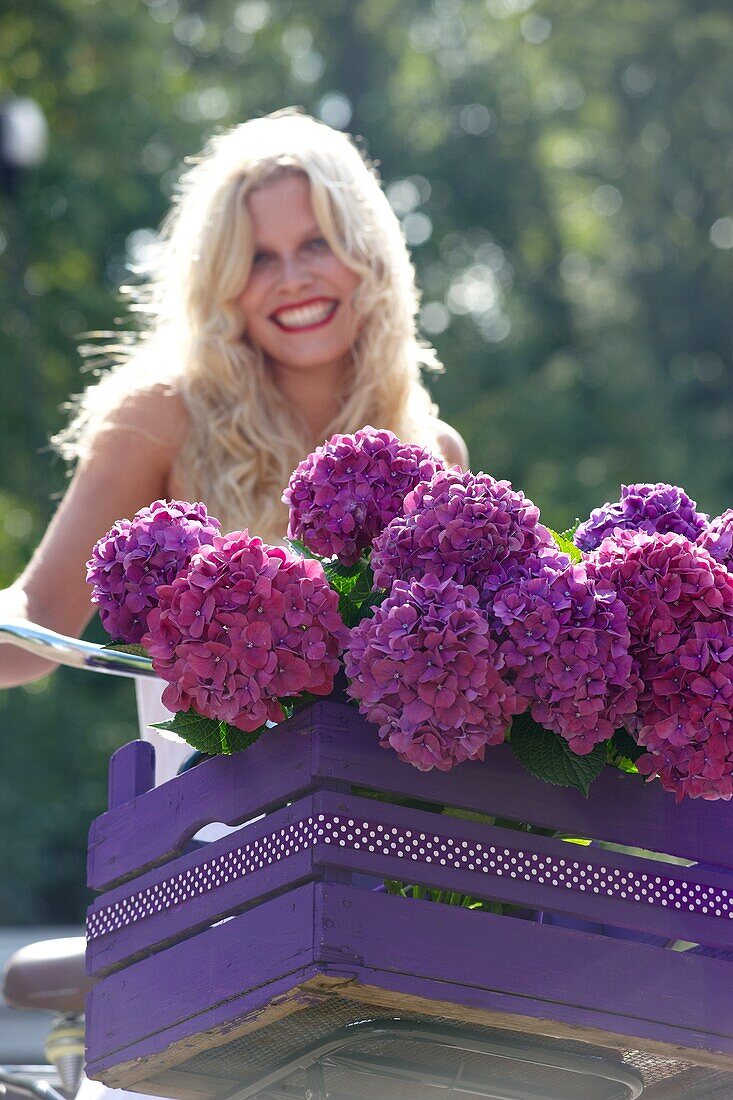 Woman with bike and flowers