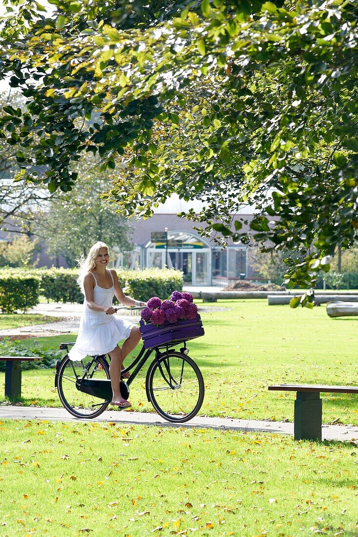 Woman riding bike in park