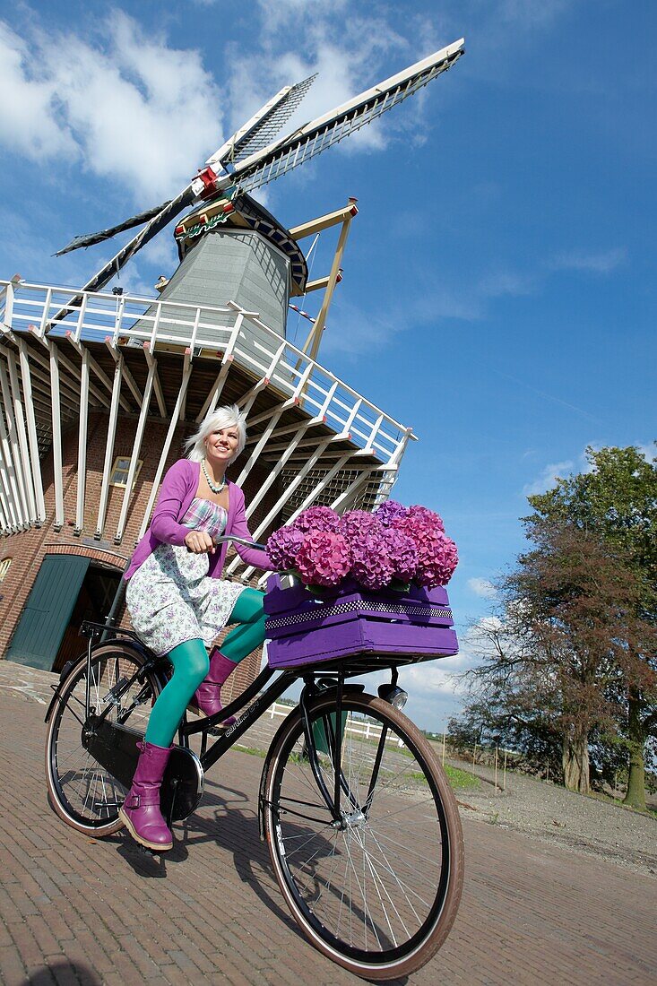 Woman riding bike in park