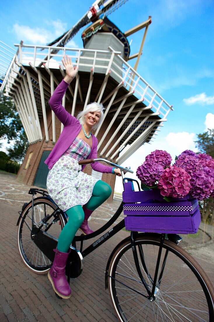 Woman riding bike in park