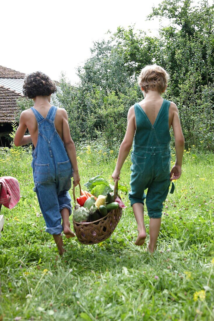 Children carrying vegetables