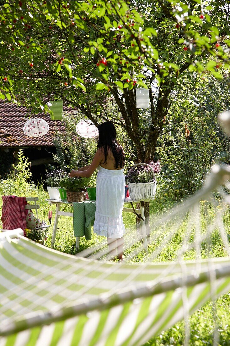 Woman in summer garden