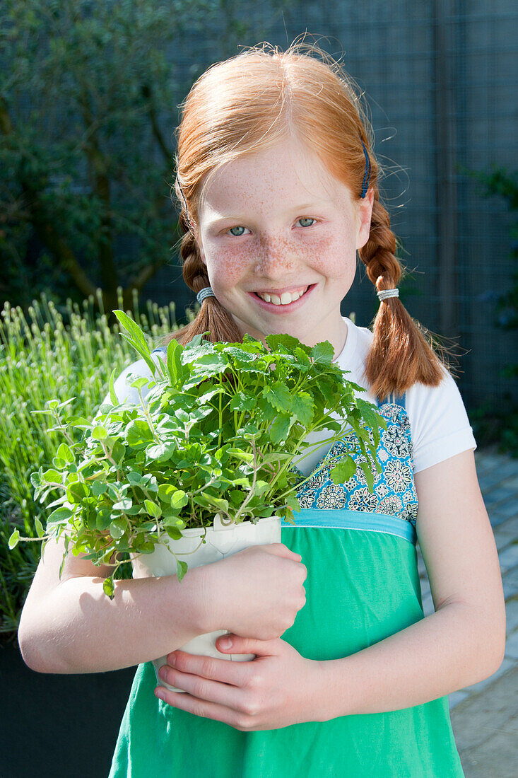 Girl holding herbs