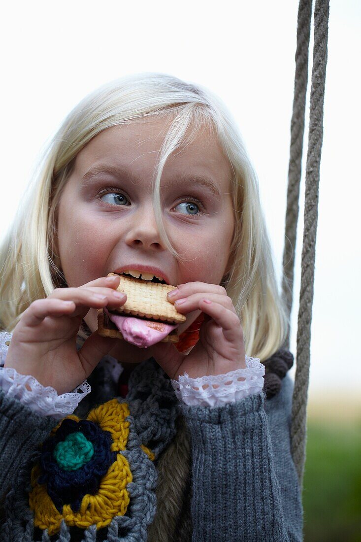 Girl eating s'mores