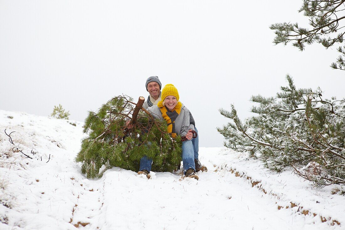 Couple with christmas tree