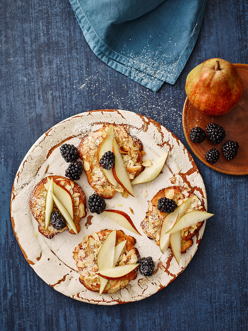 Bostock tartlets with miso almond cream, pears and blackberries