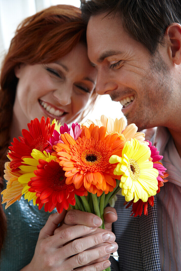 Couple holding flowers