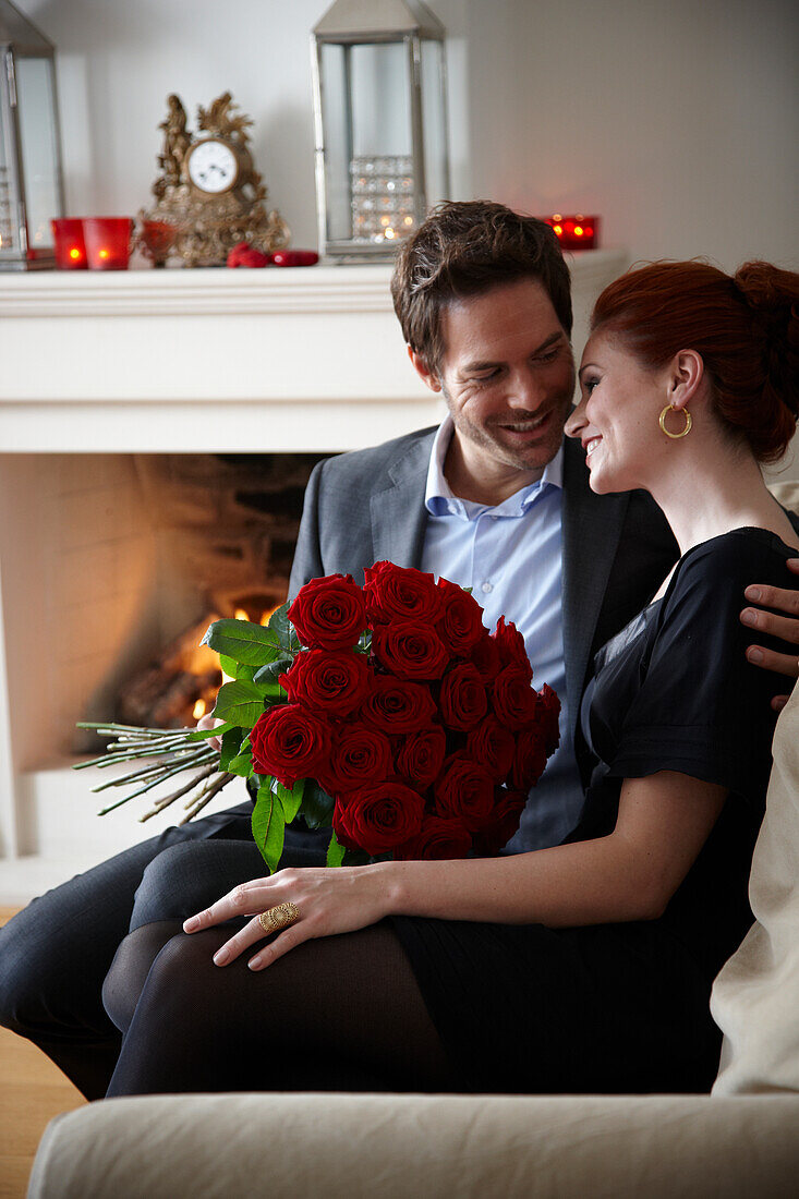 Couple holding red roses