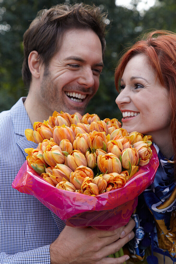 Couple holding flowers