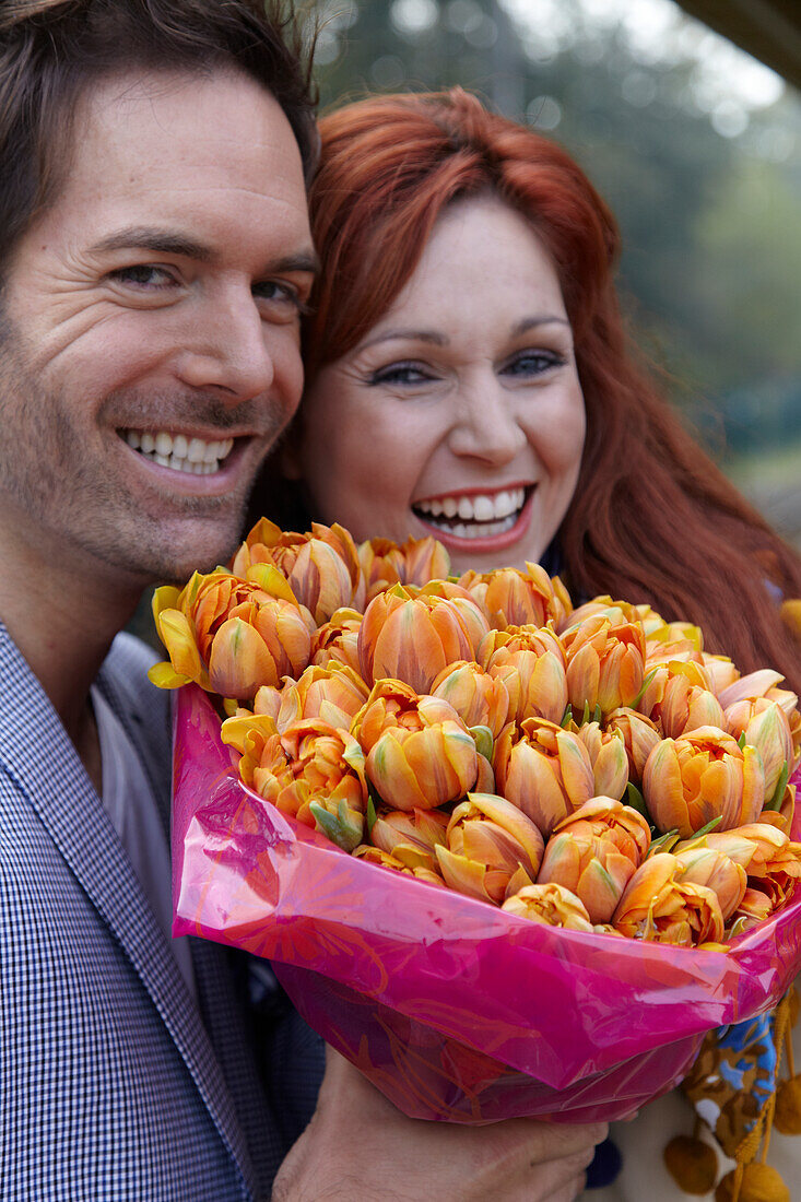 Couple holding flowers