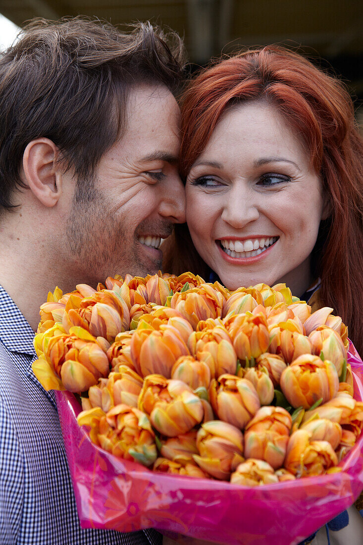 Couple holding flowers