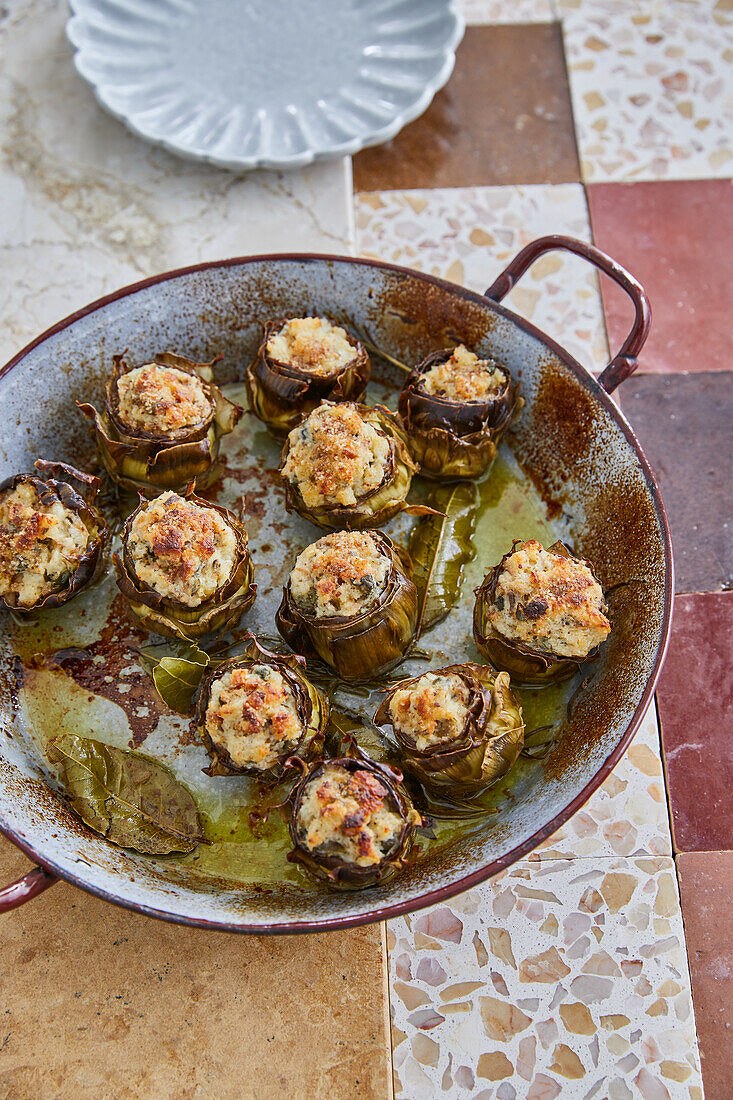 Stuffed artichokes with ricotta, anchovies, olives and parmesan cheese