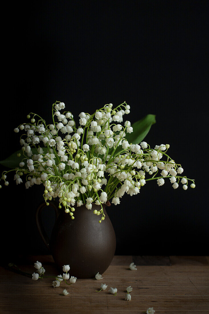 Bouquet of lily of the valley (Convallaria majalis) in a vase