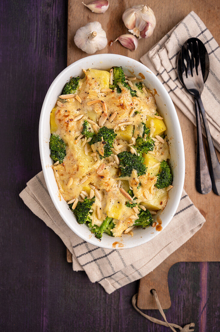 Vegan broccoli and potato casserole with almonds