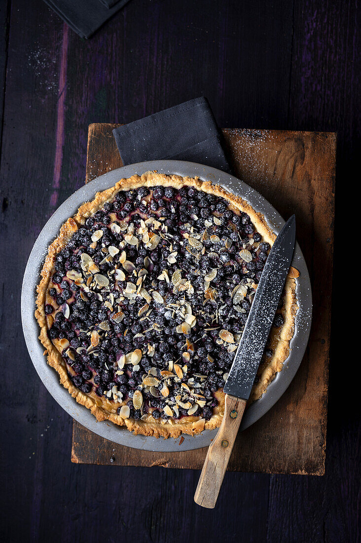 Vegan blackcurrant and cheese tart with almonds