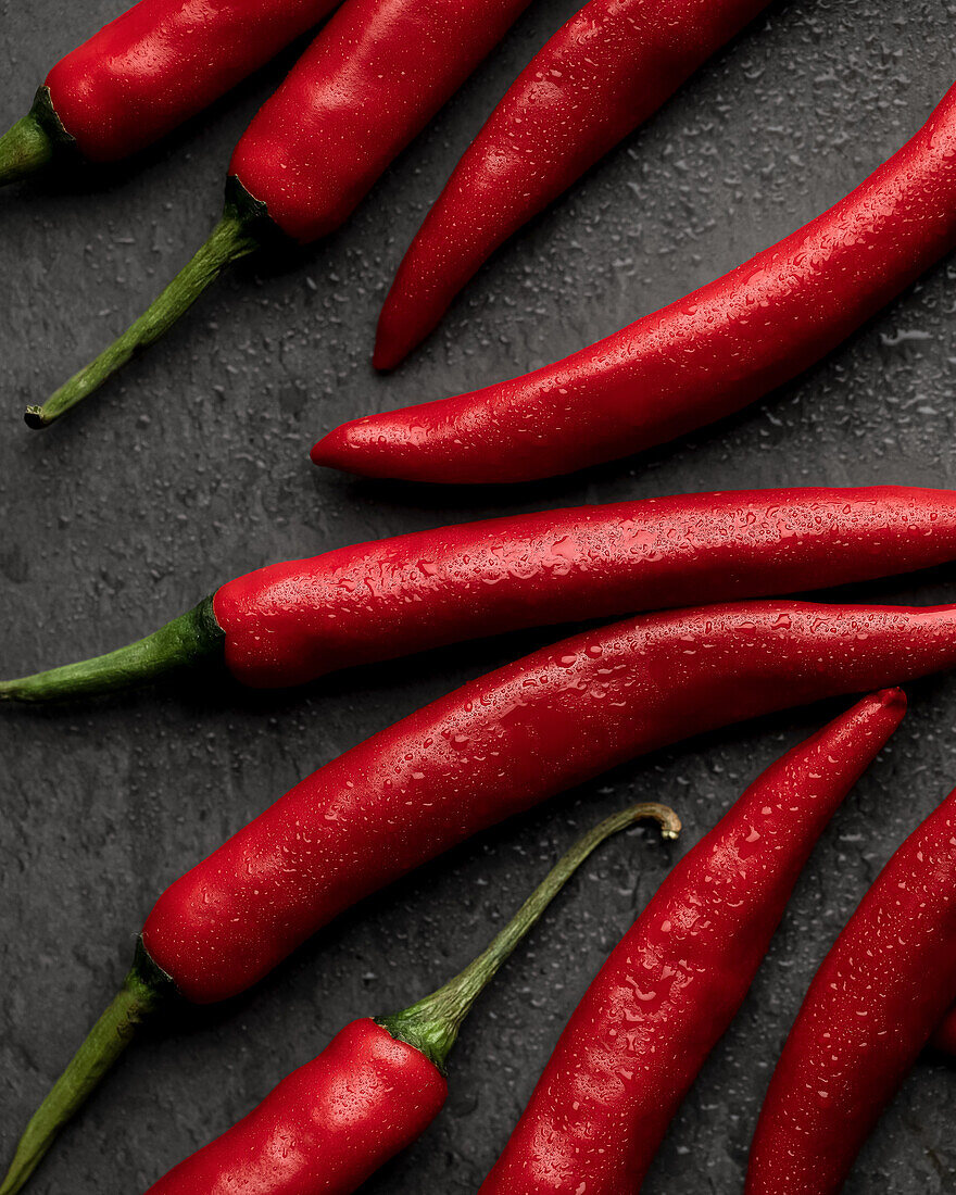 Red chillies on a grey background