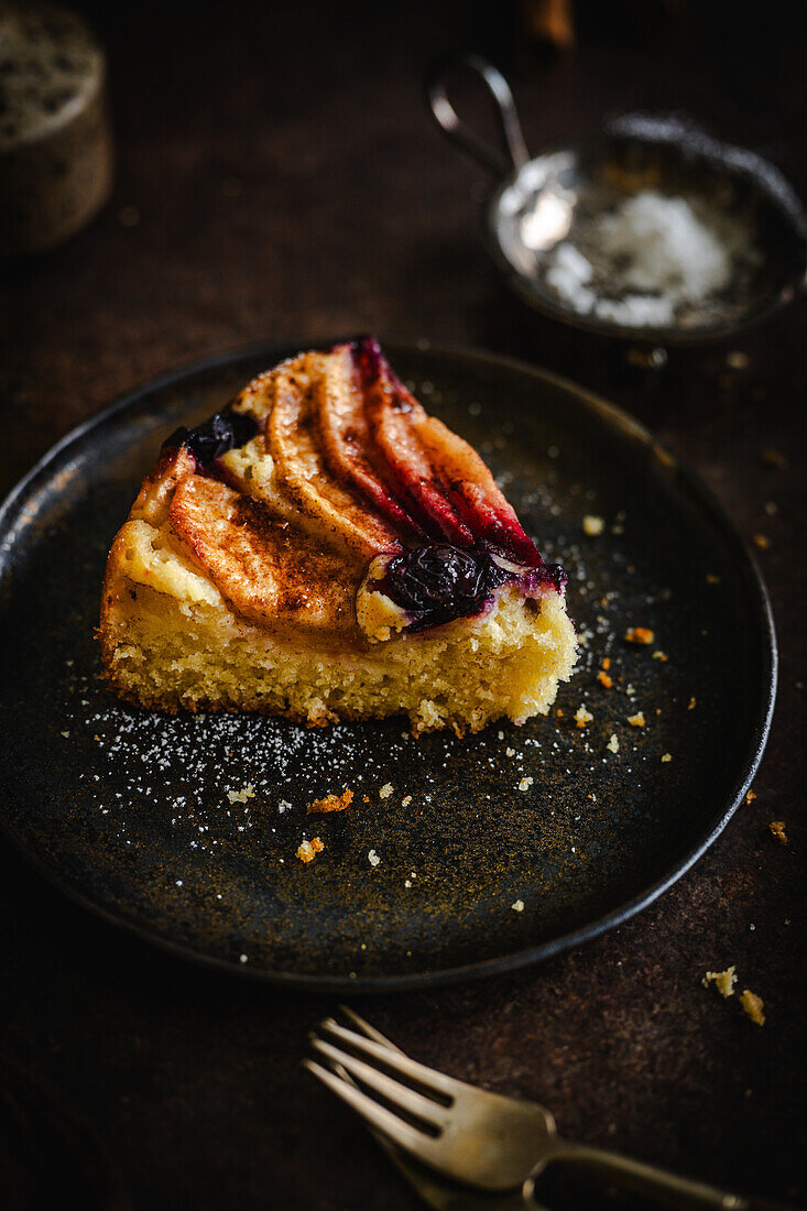 Pieces of cake with apples, cinnamon and blueberries