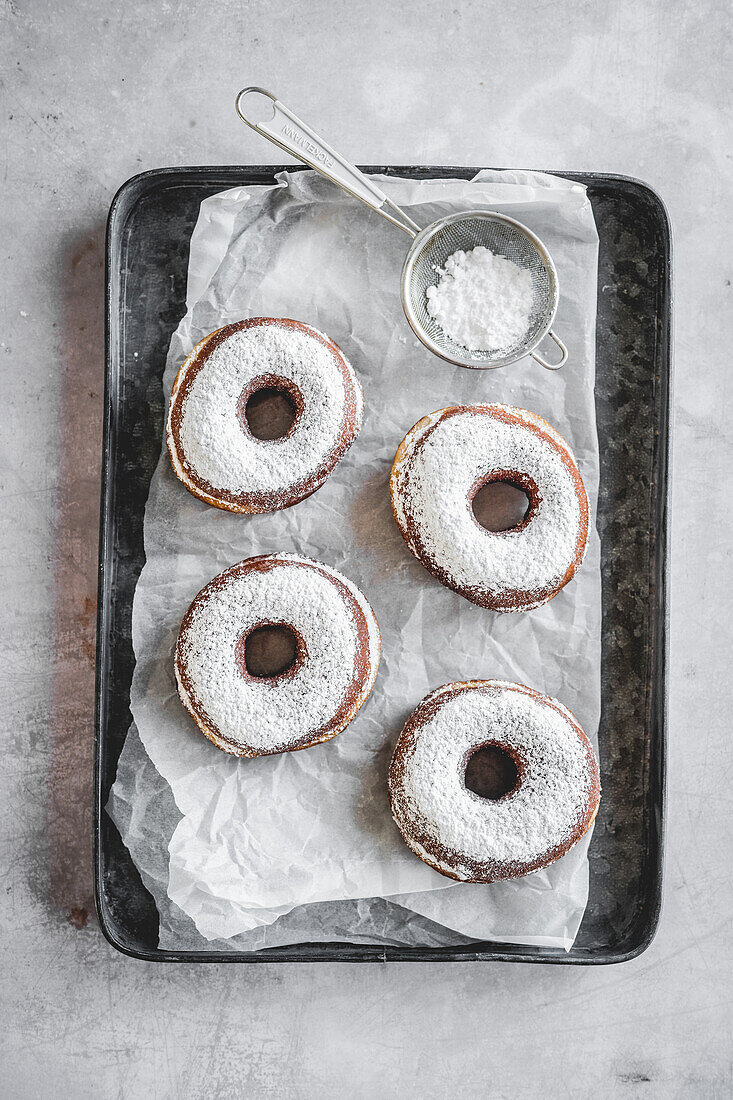 Donuts sprinkled with icing sugar