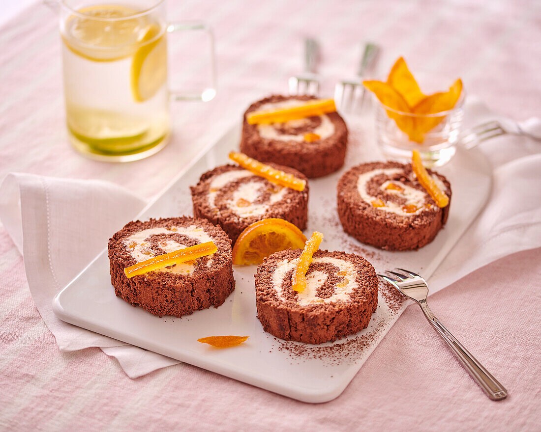 Chocolate sponge roulade with candied oranges