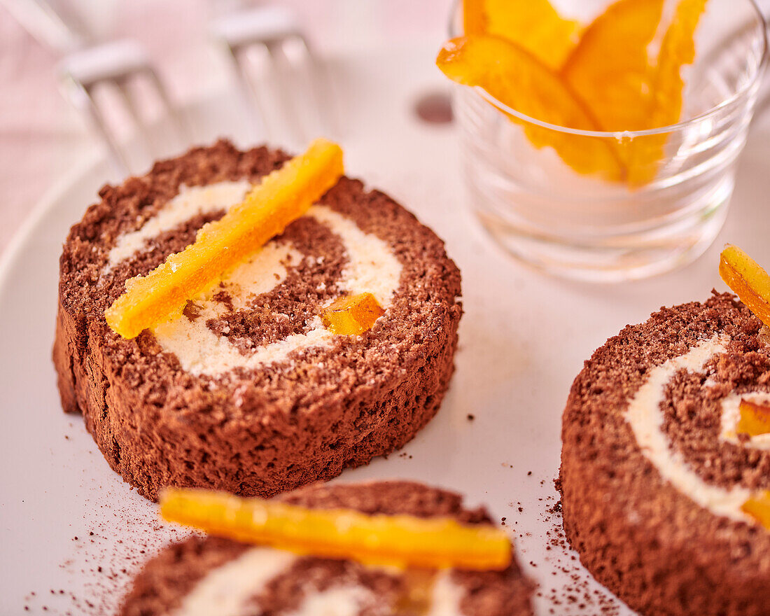 Chocolate sponge roulade with candied oranges