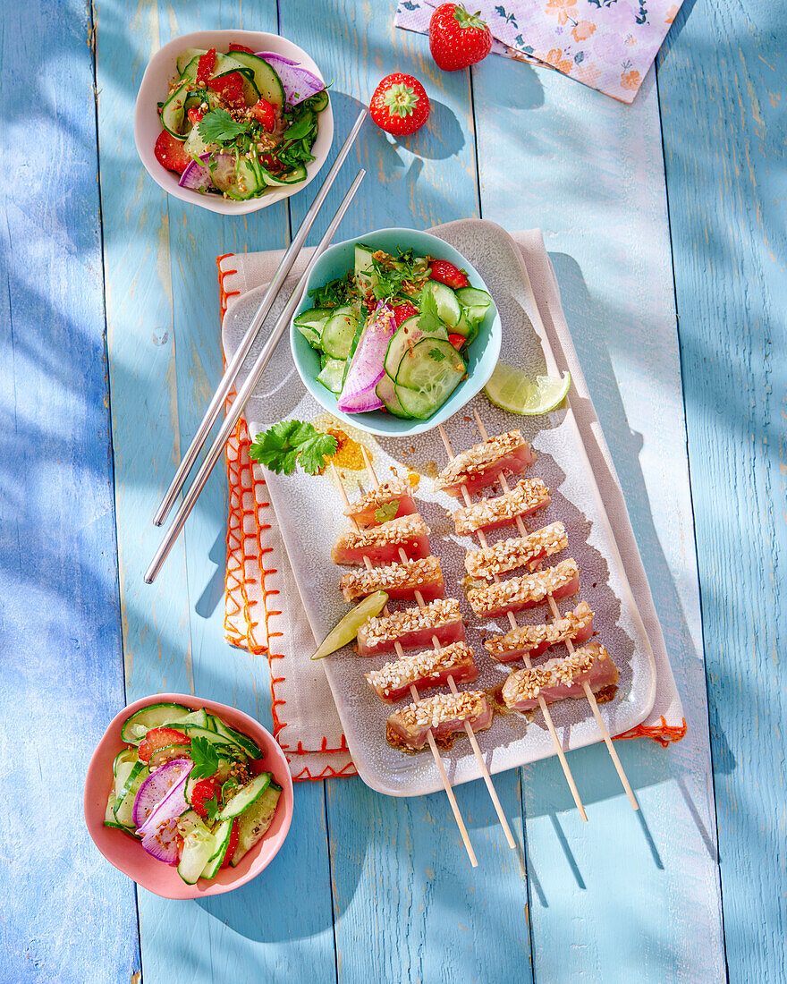 Grilled tataki salmon skewers with cucumber salad