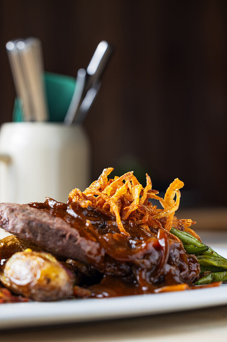 Onion roast with jacket potatoes and beans