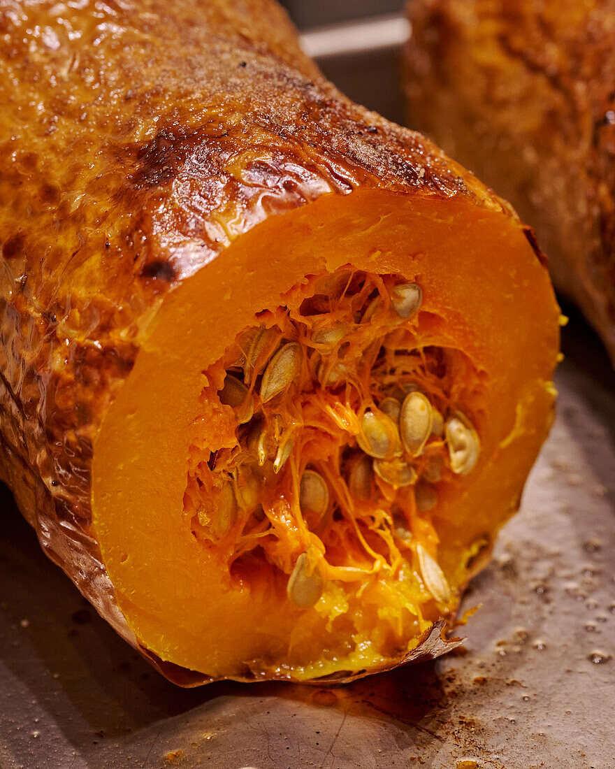 Baked butternut squash on baking tray