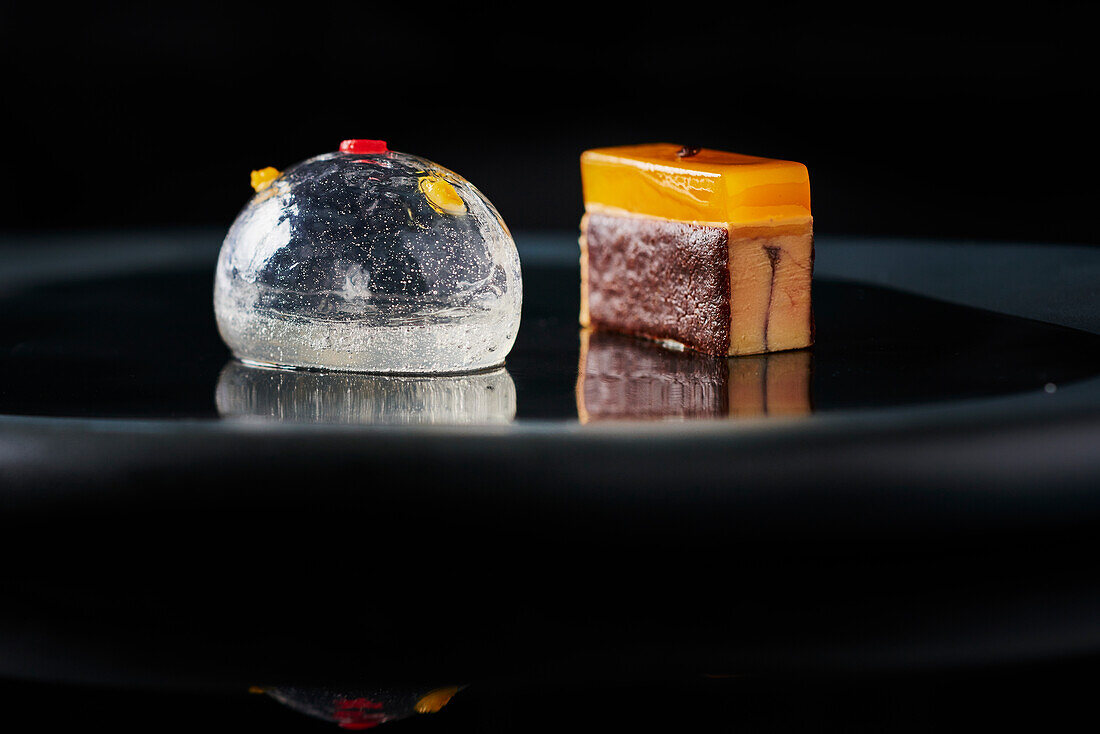Ginger sphere with orange and Campari, foie gras with gingerbread (molecular cuisine)