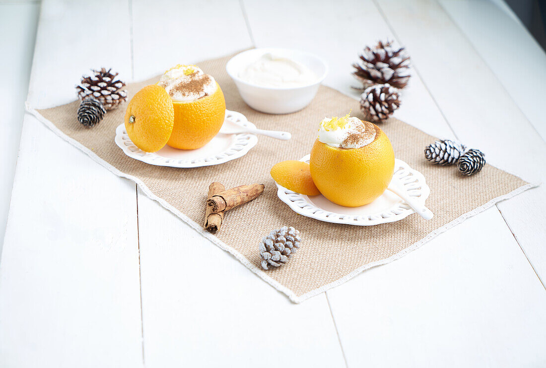Stuffed oranges with cream mousse and cinnamon