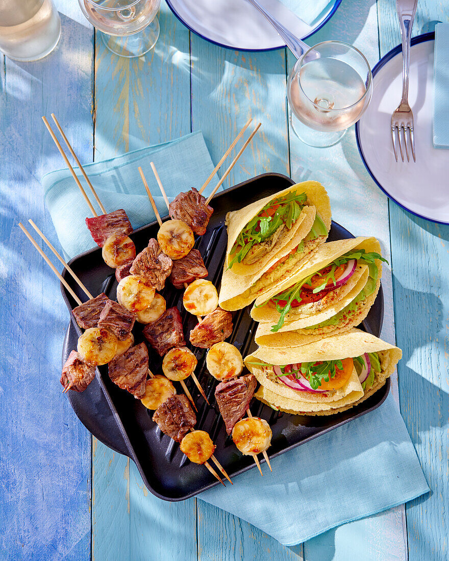 Banana and meat skewers and vegetable fajitas