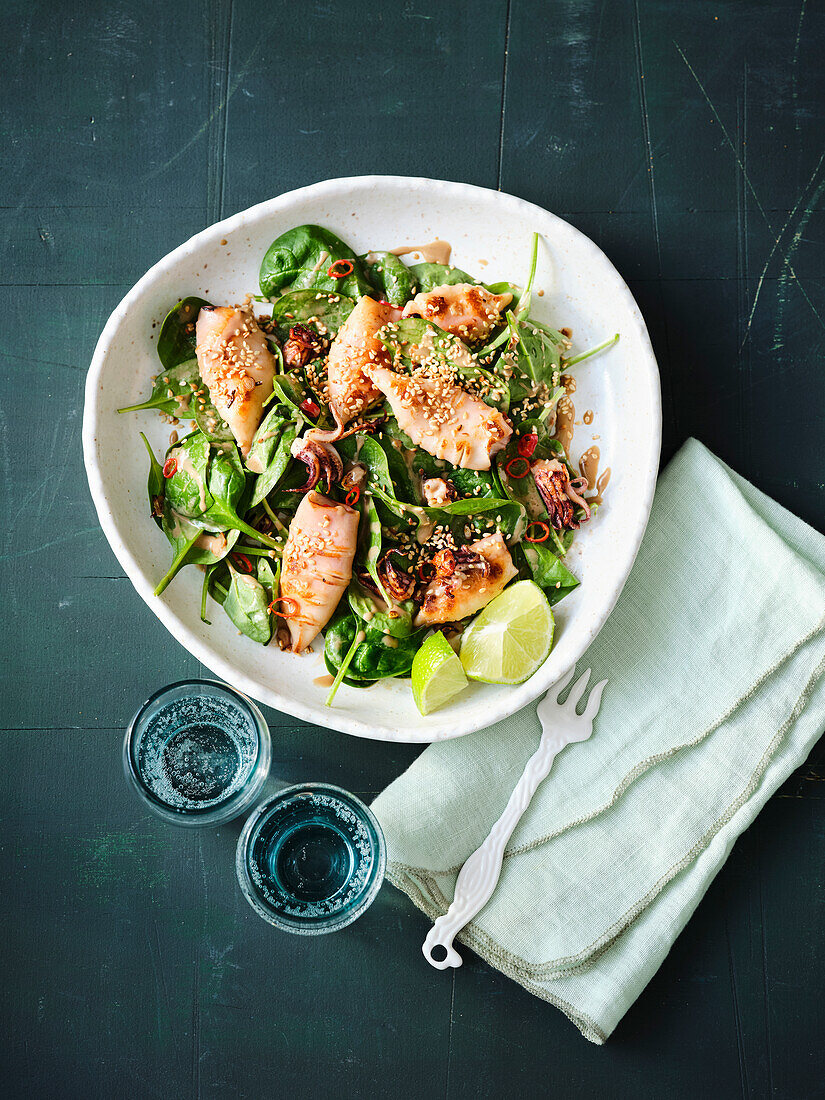 Baby spinach salad with calamaretti and sesame garlic chilli sauce