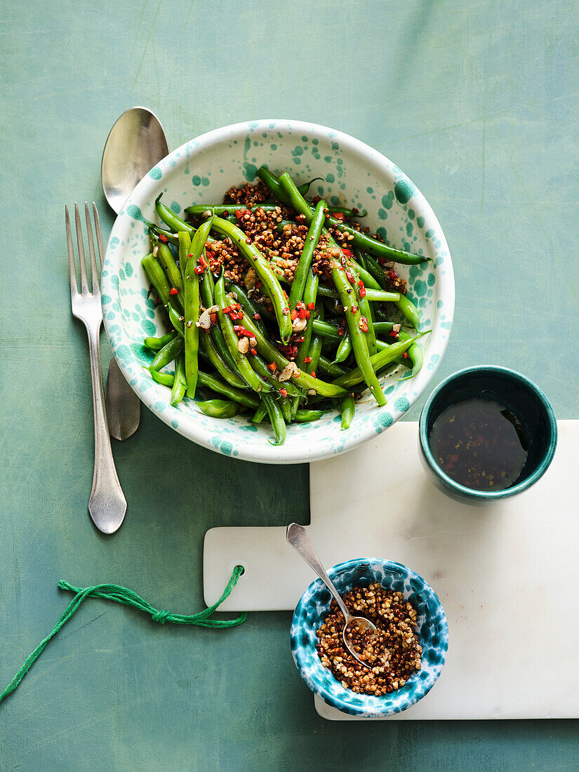 Green bean salad with garlic and puffed buckwheat