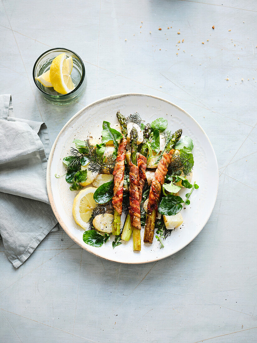 Jacket potato and herb salad with fried green asparagus spears