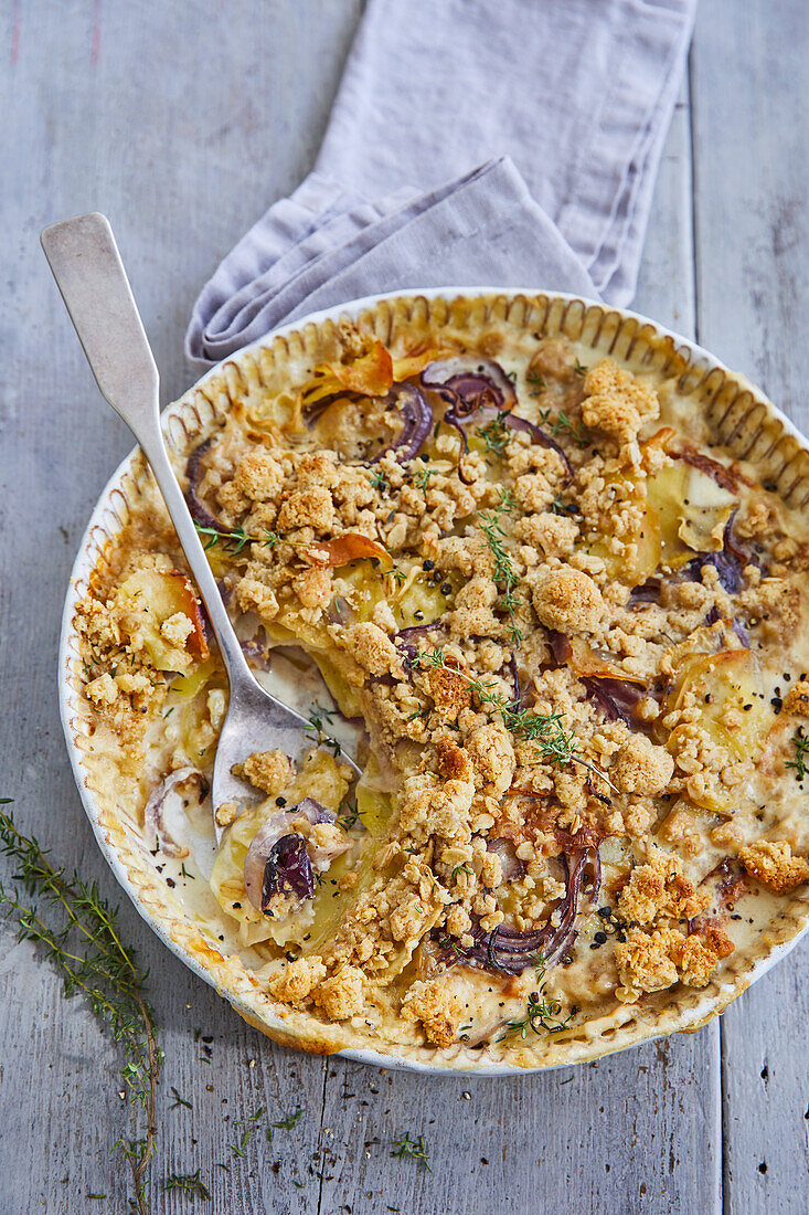 Celery and potato gratin with oat and herb crust and mountain cheese