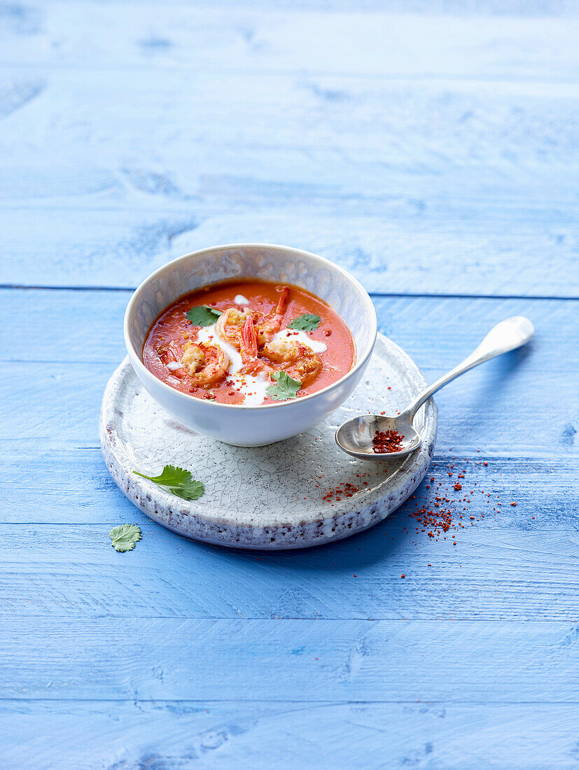 Tomato and coconut soup with prawns