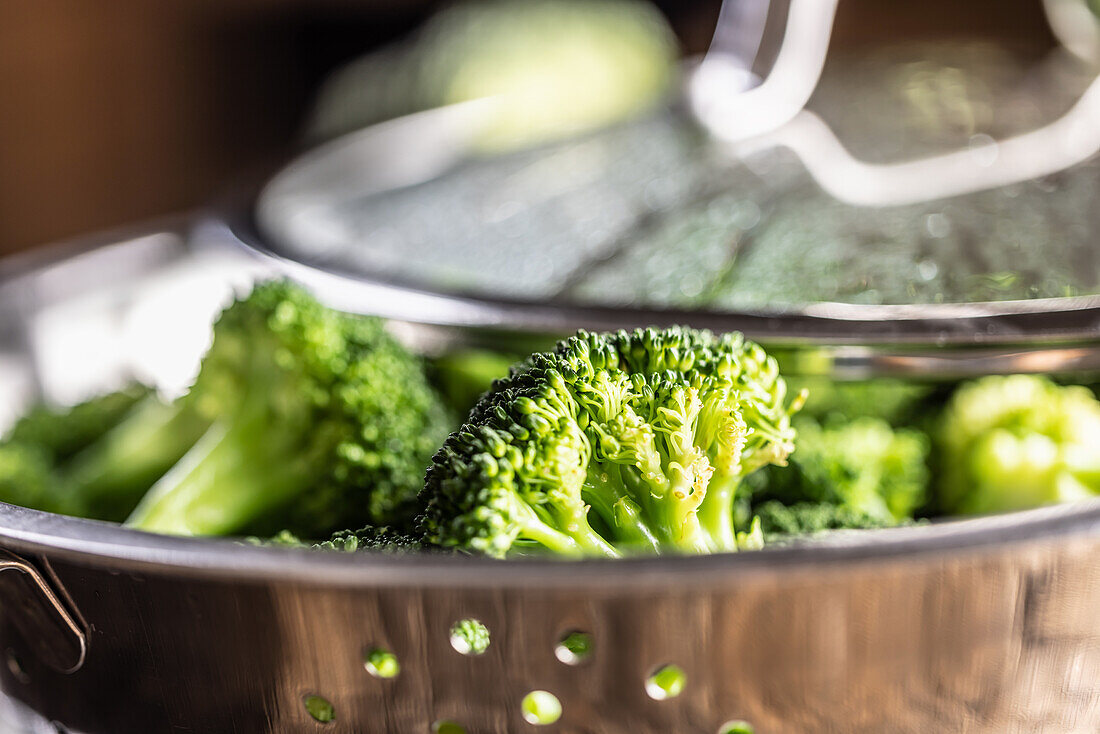 Steamed broccoli in stainless steel steamer
