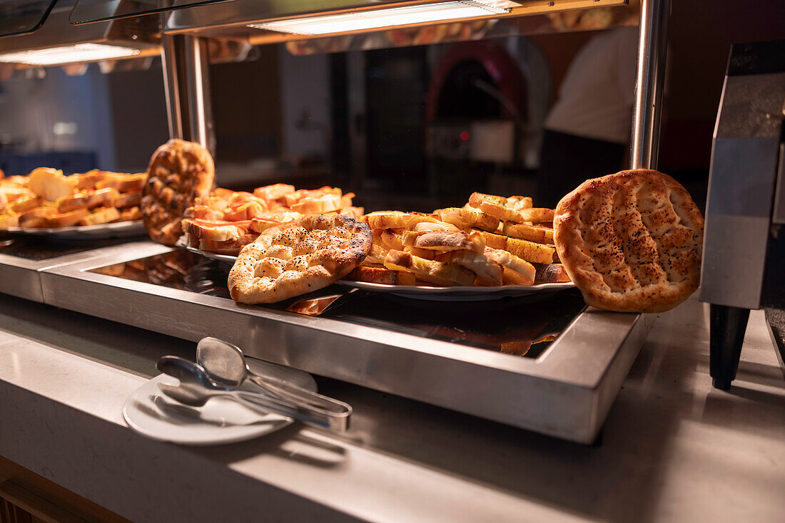 Turkish flatbread and bruschetta on buffet table in hotel
