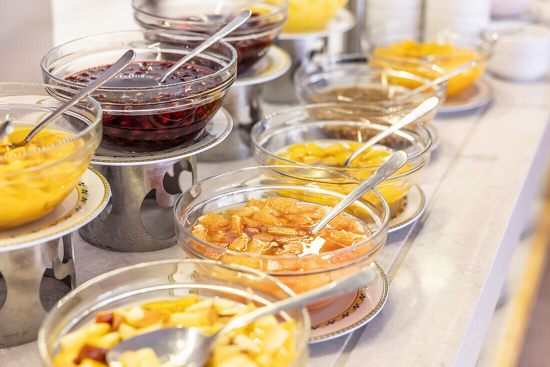 Fruit compote in bowls on buffet table in restaurant