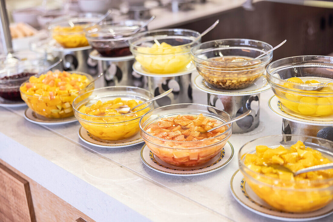 Fruit compote in bowls at the buffet in a hotel restaurant
