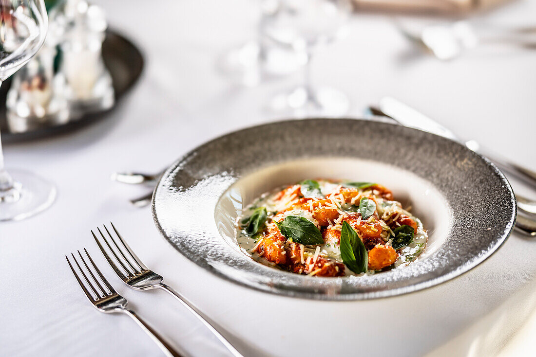 Tomato gnocchi with mascarpone, cream, basil and parmesan