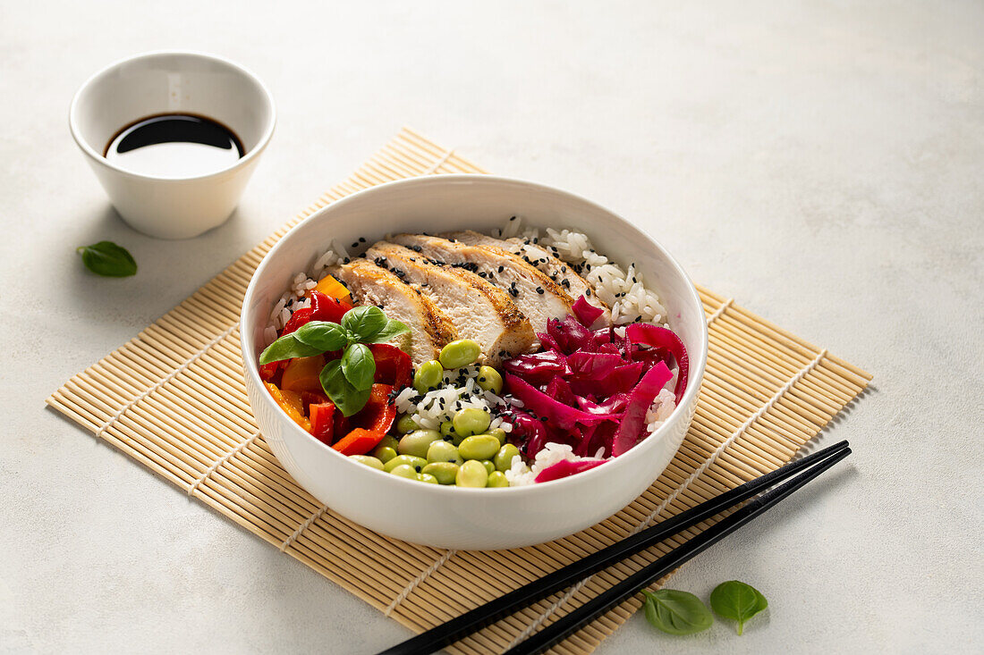 Chicken sweet pepper poke bowl with edamame beans and pickled red cabbage