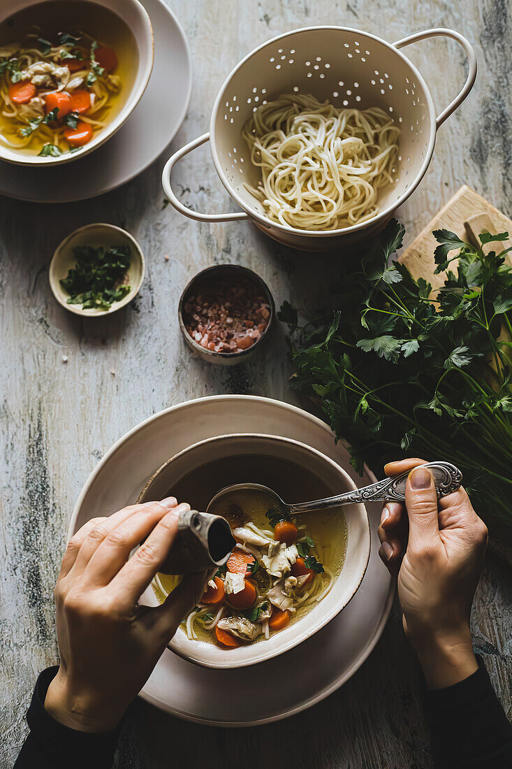 Meat broth with vegetables and noodles