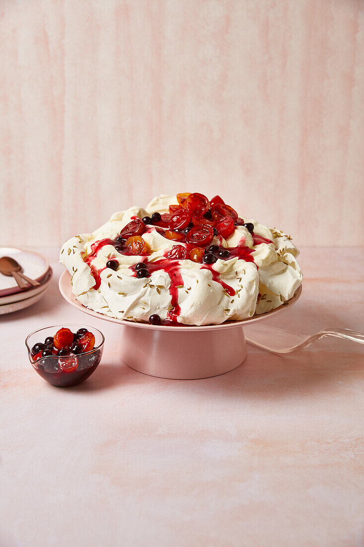 Pavlova with fennel seeds and cherry tomato compote