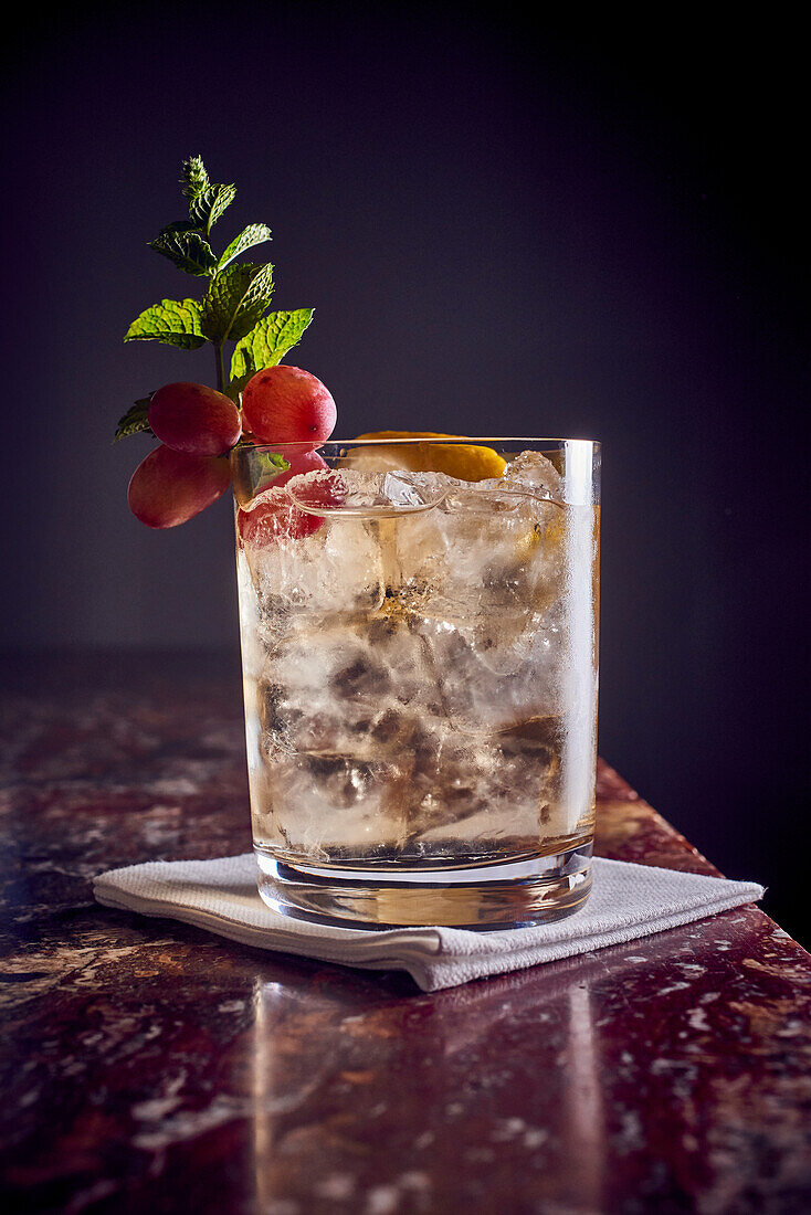 Cocktail with lemon and ice cubes