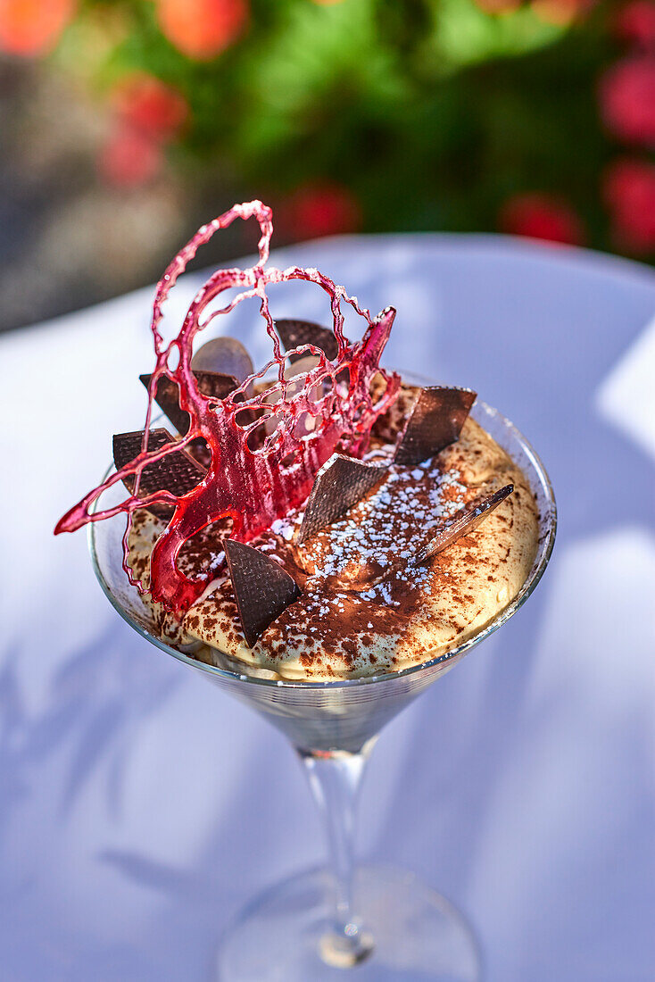 Tiramisu served in a cocktail glass