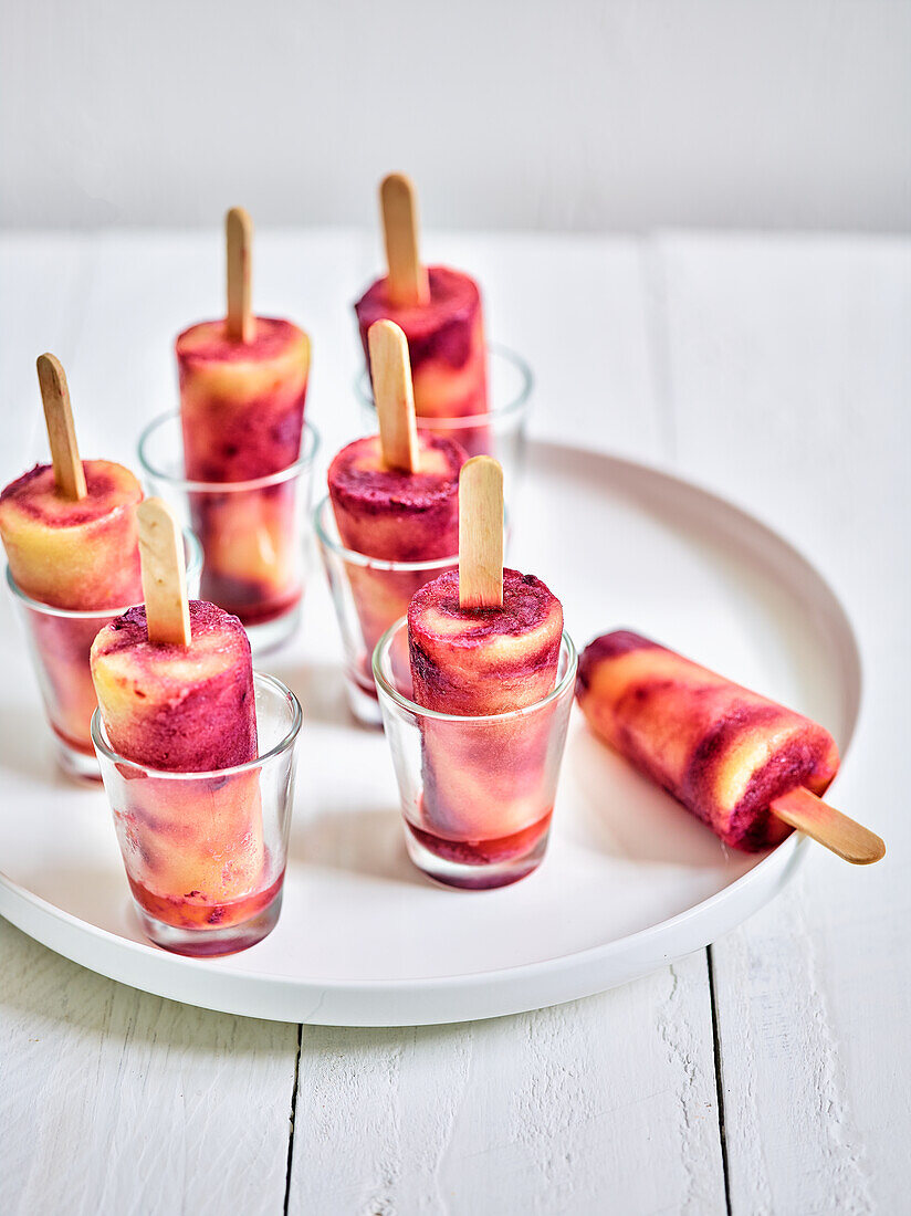 Blackberry and pineapple ice cream on a stick